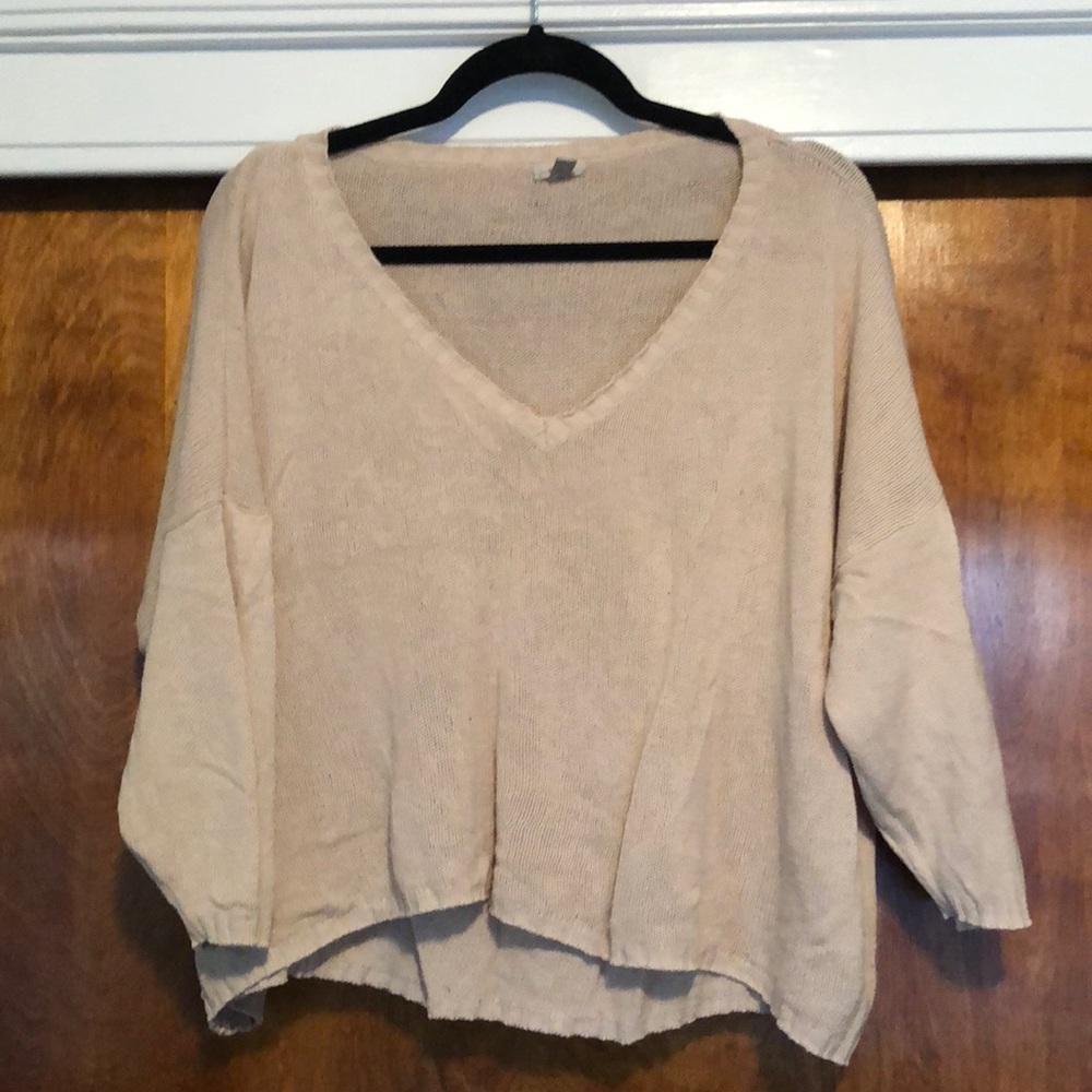 Cropped light sweater